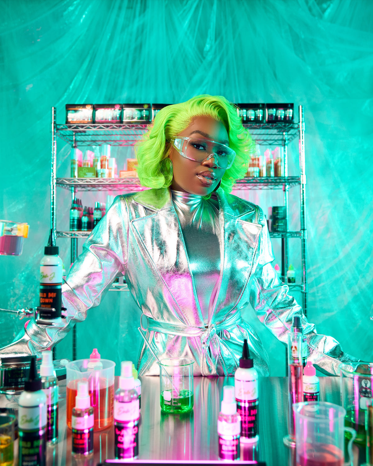 Ericka J in the lab holding lace adhesive products